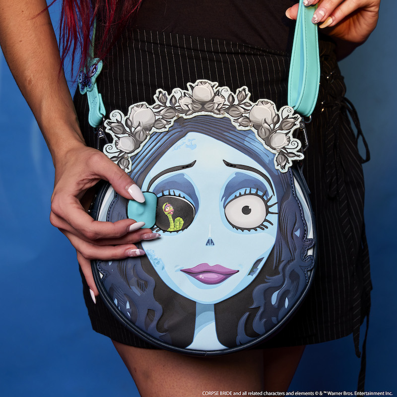 Woman wearing the Corpse Bride Emily Crossbody with her eye open to reveal Maggot behind it